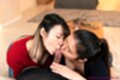 Girls kissing cock head on their knees